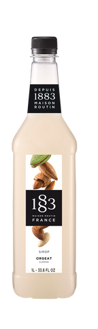 Maison Routin 1883 Almond Flavoring syrup in a PET bottle has a milky white color