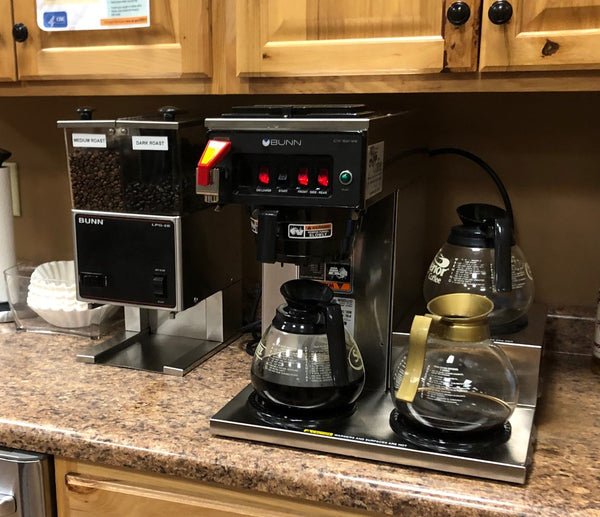 Office coffee services with a commercial coffee brewer and grinders in a professional office with locally roasted beans in the grinder