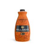 A bright orange bottle of Hollander Pumpkin Pie Sauces with a gold pumpkin in a black background