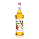 A glass bottle of Monin Apple syrup, the syrup is a bright yellow and the label have red, green and  yellow apples on it