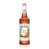 a busy front label with cinnamon sticks, vanilla beans a bowl of brown sugar and other spices make you want to sample this syrup