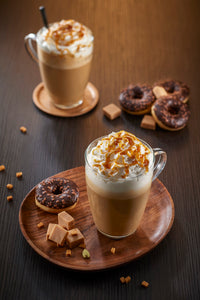 Caramel Macchiato is just one of the specialty drinks customers make with Caramel Sauce this one is topped with whipped cream and garnished with caramel in clear glass cup so you can see the espresso