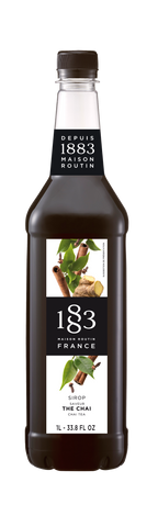 1883 Chai syrup is dark brown in color with spices on the label 