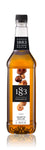1883 Roasted Hazelnut is a golden yellow with a variety of hazelnuts on the label