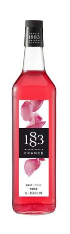 1883 Rose is a bright pink color with bright pink rose peddles on the label  