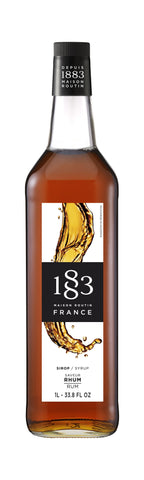1883 Rum has a nice brown color the rum liquid on the bottle is a golden brown splattered down the label