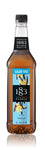 1883 Sugar Free Vanilla  is light brown with vanilla beans and yellow flowers on the label with a light blue background representing sugar free