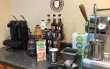 coffee shop products and equipment including an espresso machine, airpots for coffee, 1883 syrups, Hollander sauces and barista tools