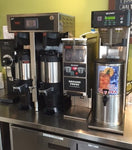 several pieces of coffee equipment including a Curits brewer, bunn grinder, bunn iced tea machine