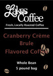 a black coffee  label for cranberry creme brule coffee with light maroon letters 