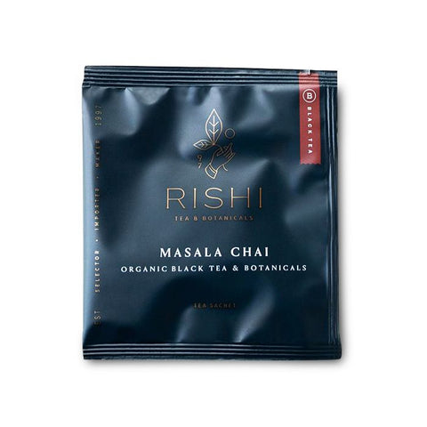 a black package of Rishi masala Chai tea with white lettering on the black background